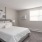 Large bedroom with plush floors and a large window